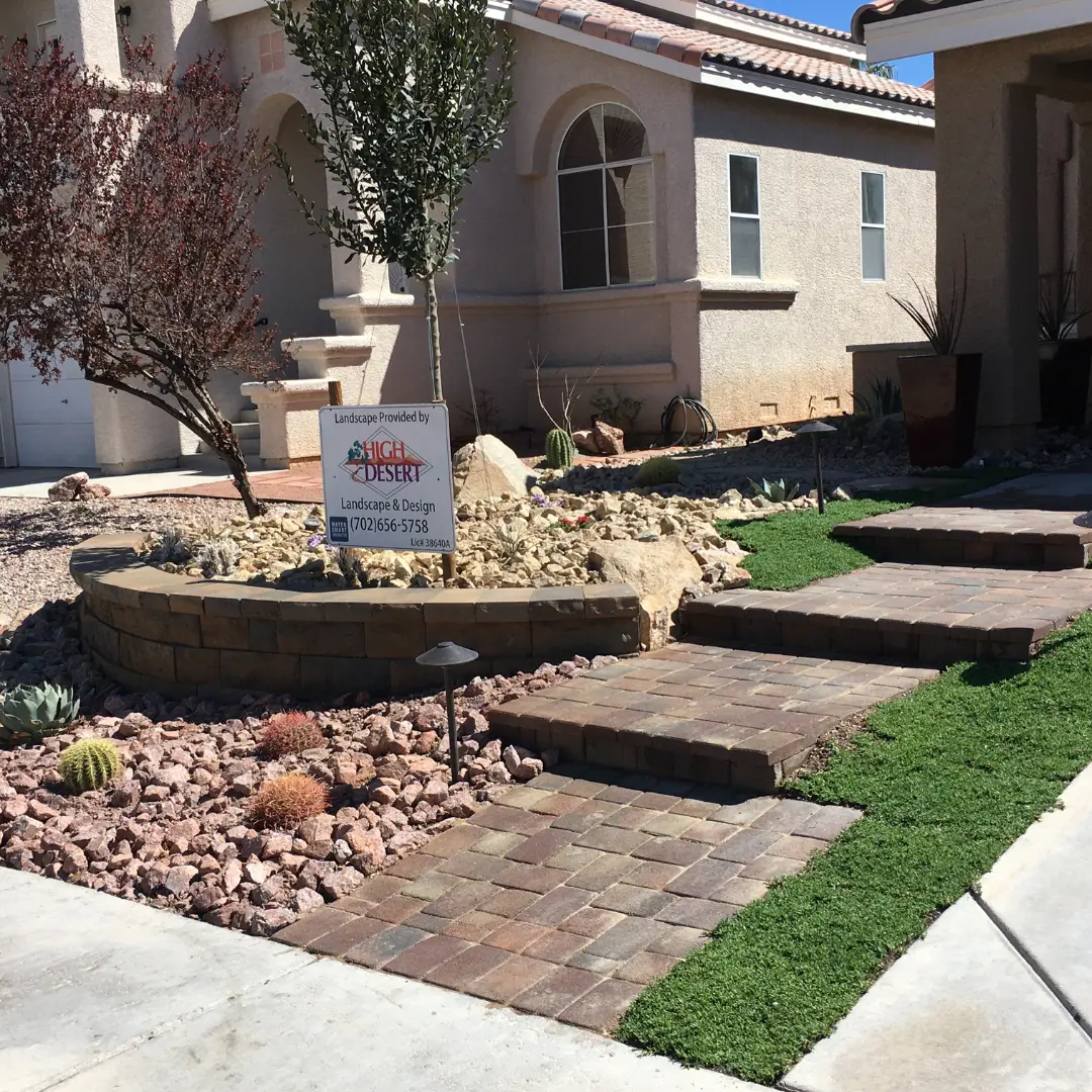 Stone pathway and landscaped front yard.