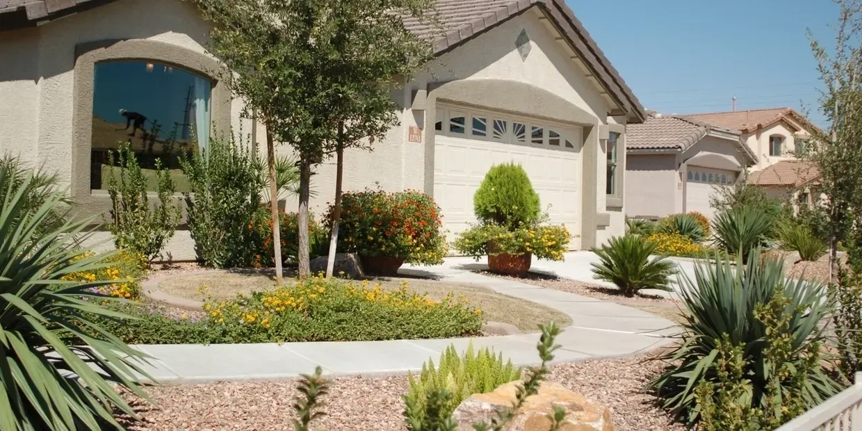 Suburban house with landscaped front yard.